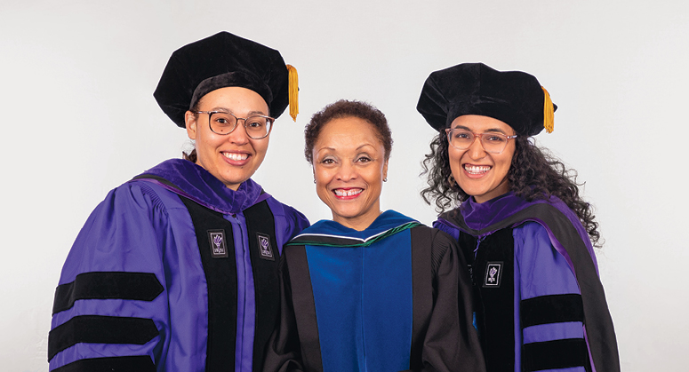 Derrick Bell Scholars for Public Service (LACA) Lauren Richardson and Devika Balaram were hooded by Janet Dewart Bell