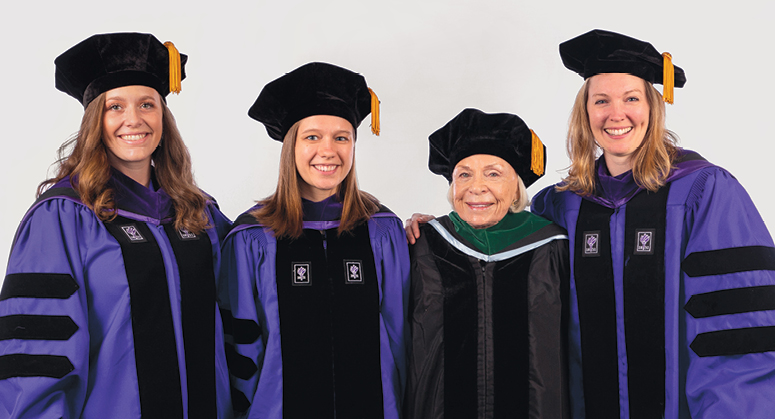 Joyce Lowinson IILJ Research Scholars Isabelle Glimcher, Sarah Coco, and  Alissa Clarke were hooded by Dr. Joyce Lowinson. Not pictured: Nathaniel Eisen