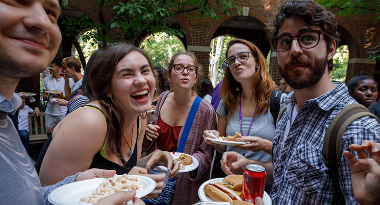 Students laughing in Vanderbilt Hall Courtyard for Orientation 2019 BBQ