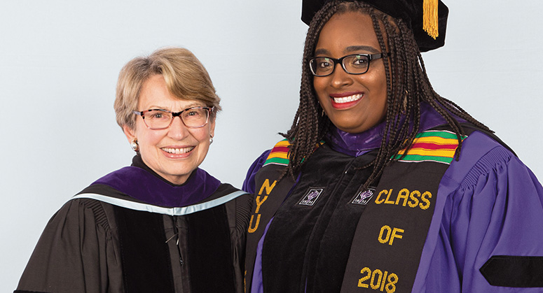 Thomas E. Heftler Scholar Kashira Patterson was hooded by Lois Weinroth