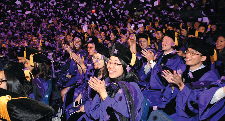 Group of students clapping at Convocation