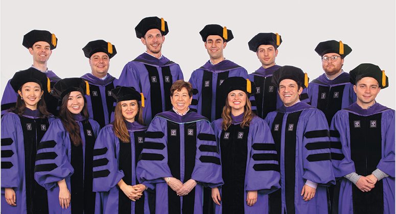 Jacobson Leadership Program in Law and Business Scholars, Back Row: Timothy Keegan, Daniel Raymer, Michael Rusie, Christopher Bhutani, Daniel Krantz, Keith Pulling Front Row:  Christine Choi, Michelle Chern, Clara Aragone-Diaz, Eliza Chute, Bix Bettwy, and Anthony DeRiso III. The graduates were hooded by Professor Helen Scott