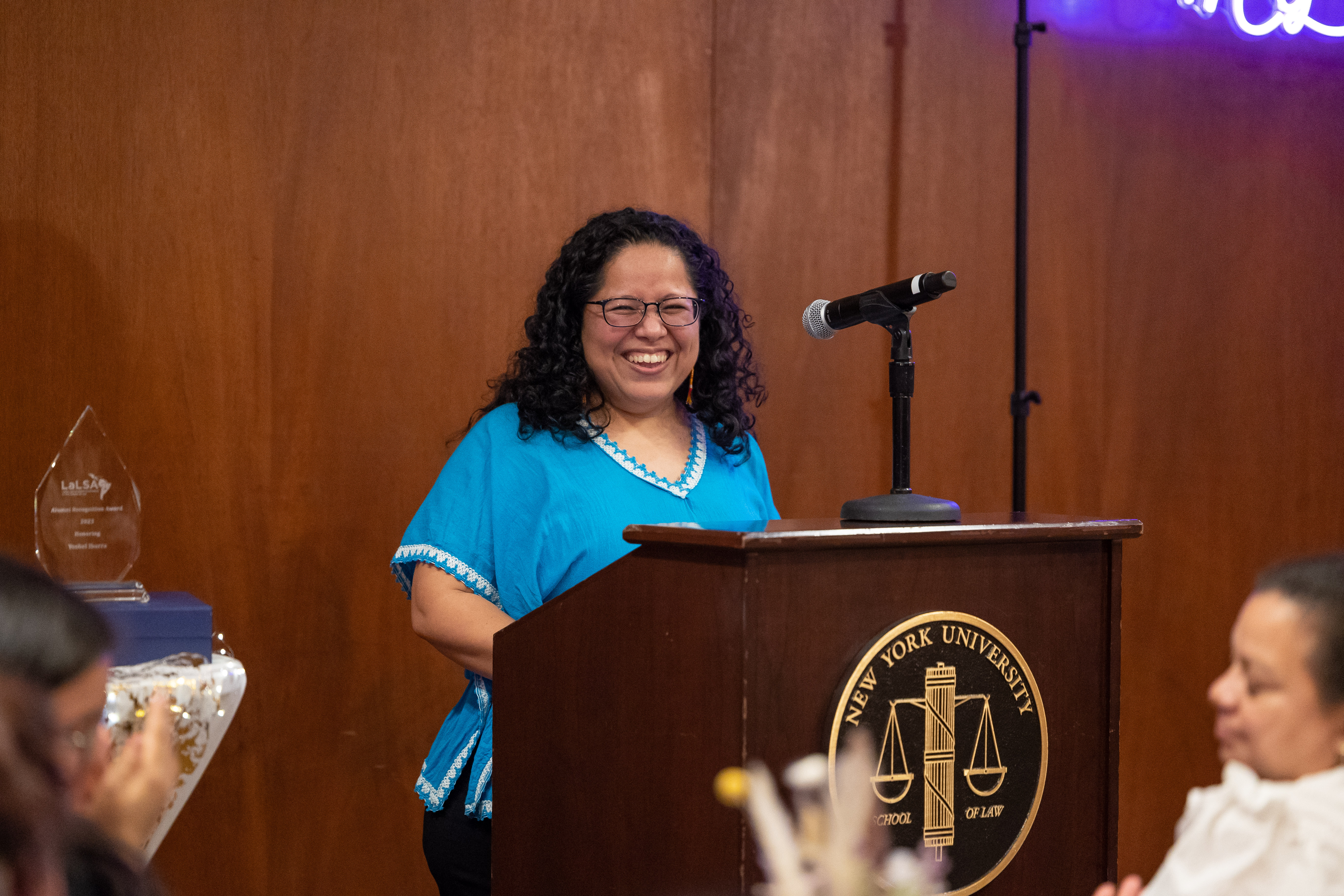 Maribel Hernández Rivera smiling at a podium