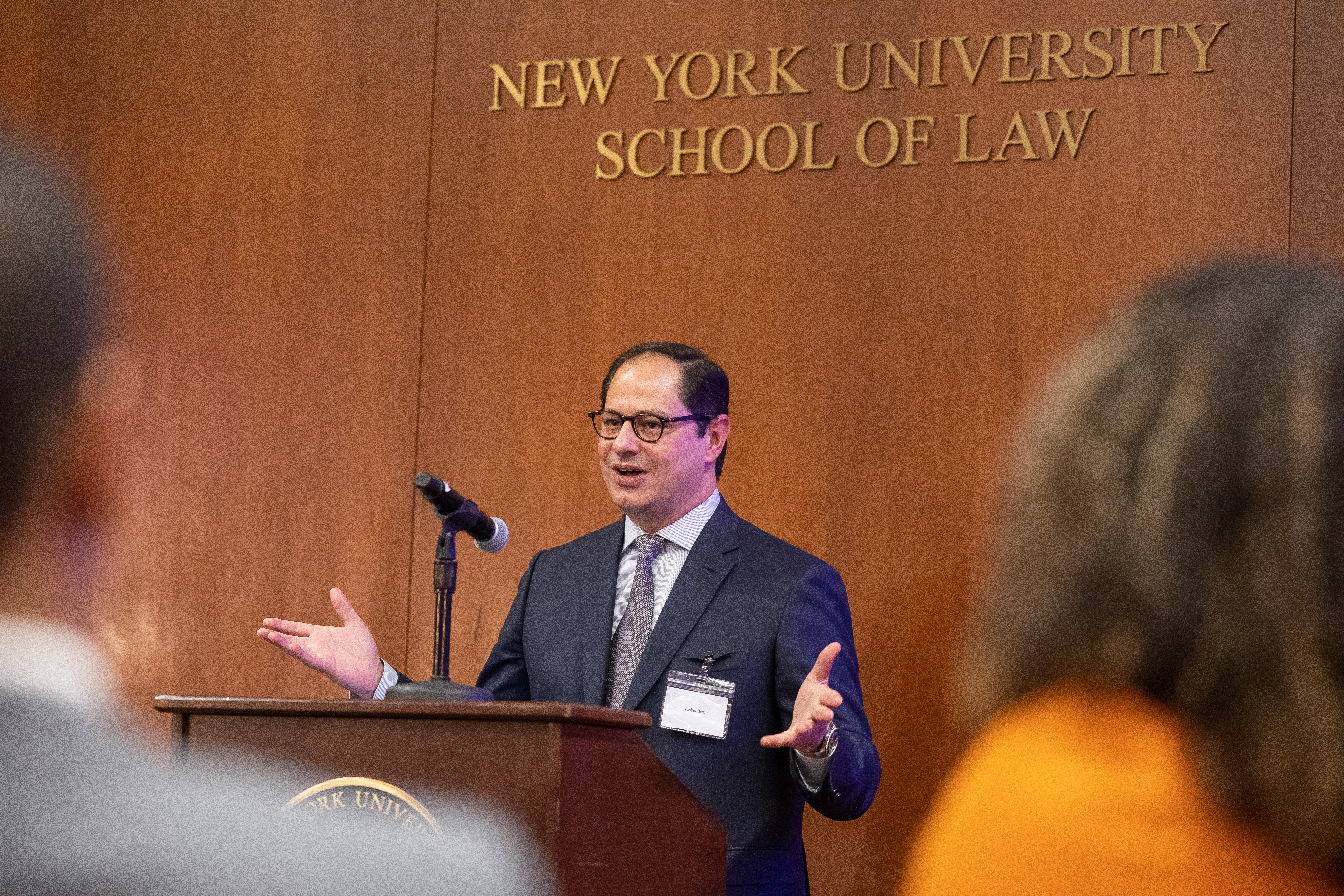 Yosbel Ibarra speaking at a podium