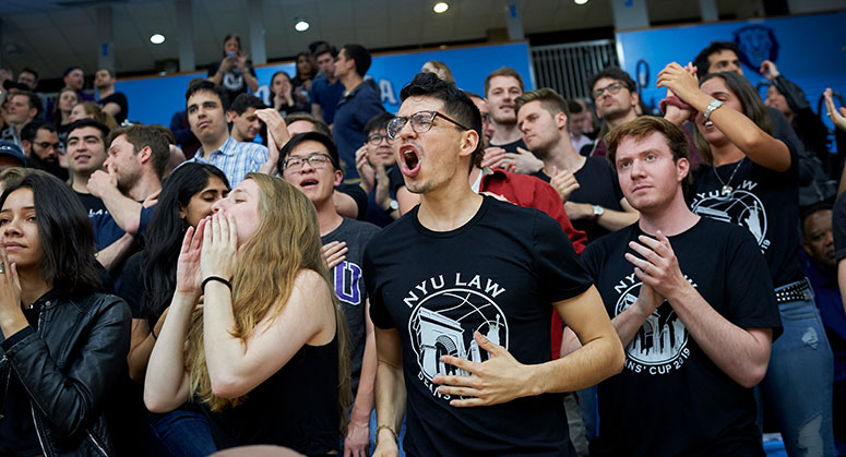 NYU Law students cheering on their peers during the 2019 Dean's Cup game