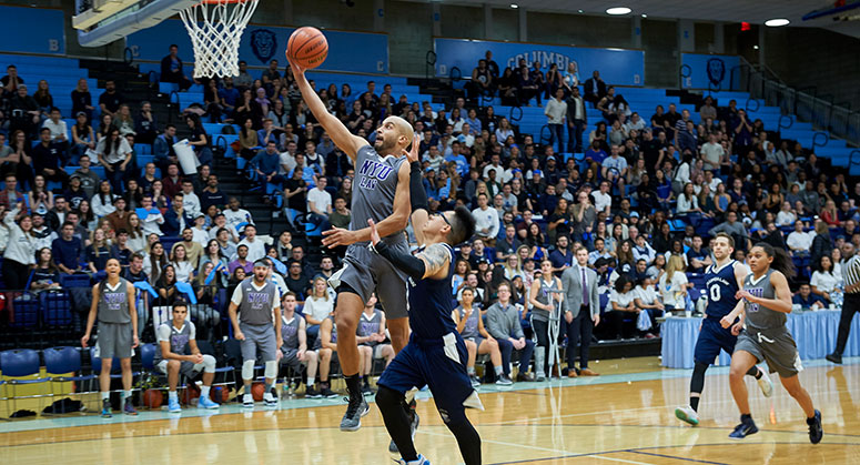 NYU Law student dunking the ball during the 2019 Dean's Cup game