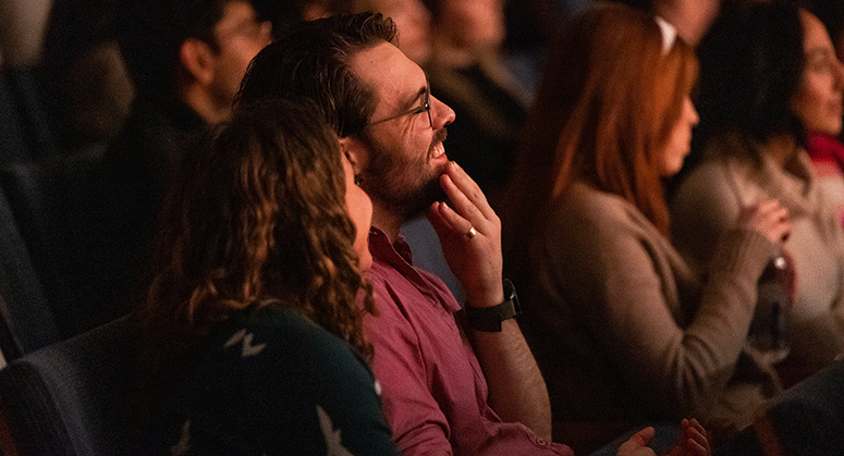 Member of the audience smiling