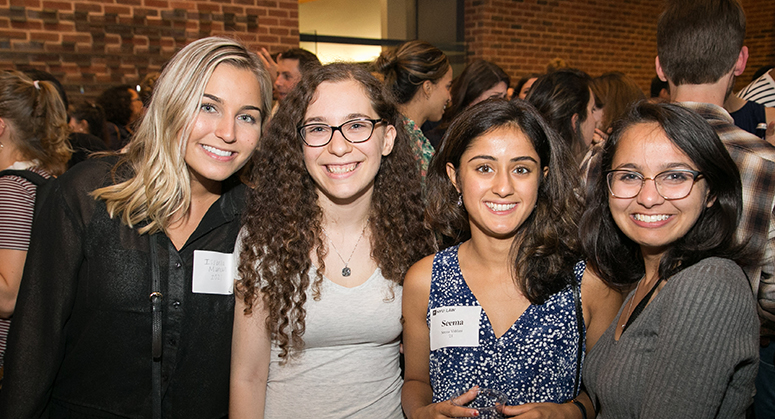 Students smiling at OutLaw/LACA reception