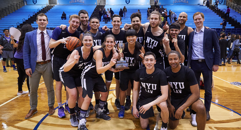 NYU Law basketball team with Dean's Cup trophy