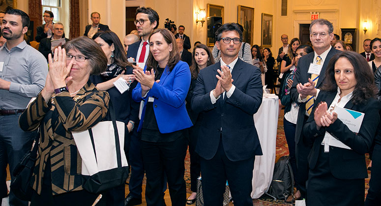 Participants at the conference applauding the Grunin Prize winner