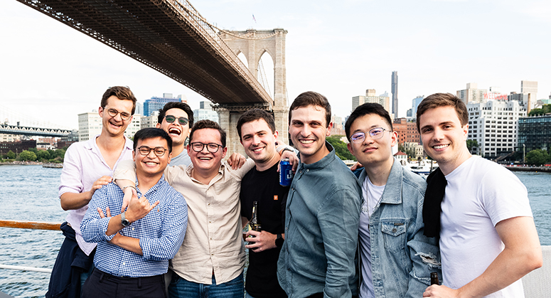 Group of LLM students posed with Brooklyn Bridge in background