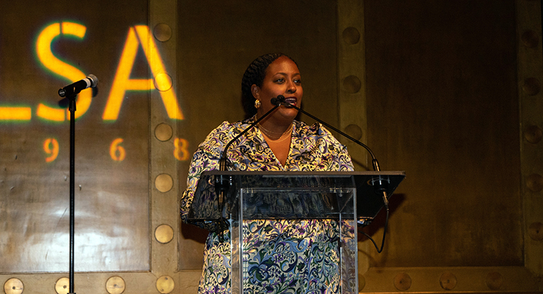 Helam Gebremariam at a lectern