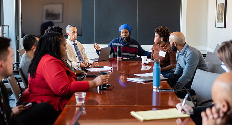 Jason Williamson leading a discussion at a seminar table