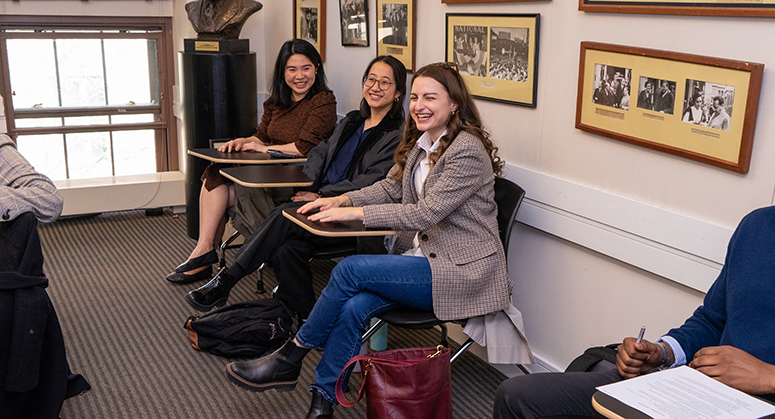 Three Furman scholars sitting in classroom 