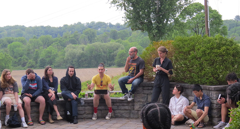 Students sitting on a wall at the ICP's Law and Organizing Academy at Borden Estate