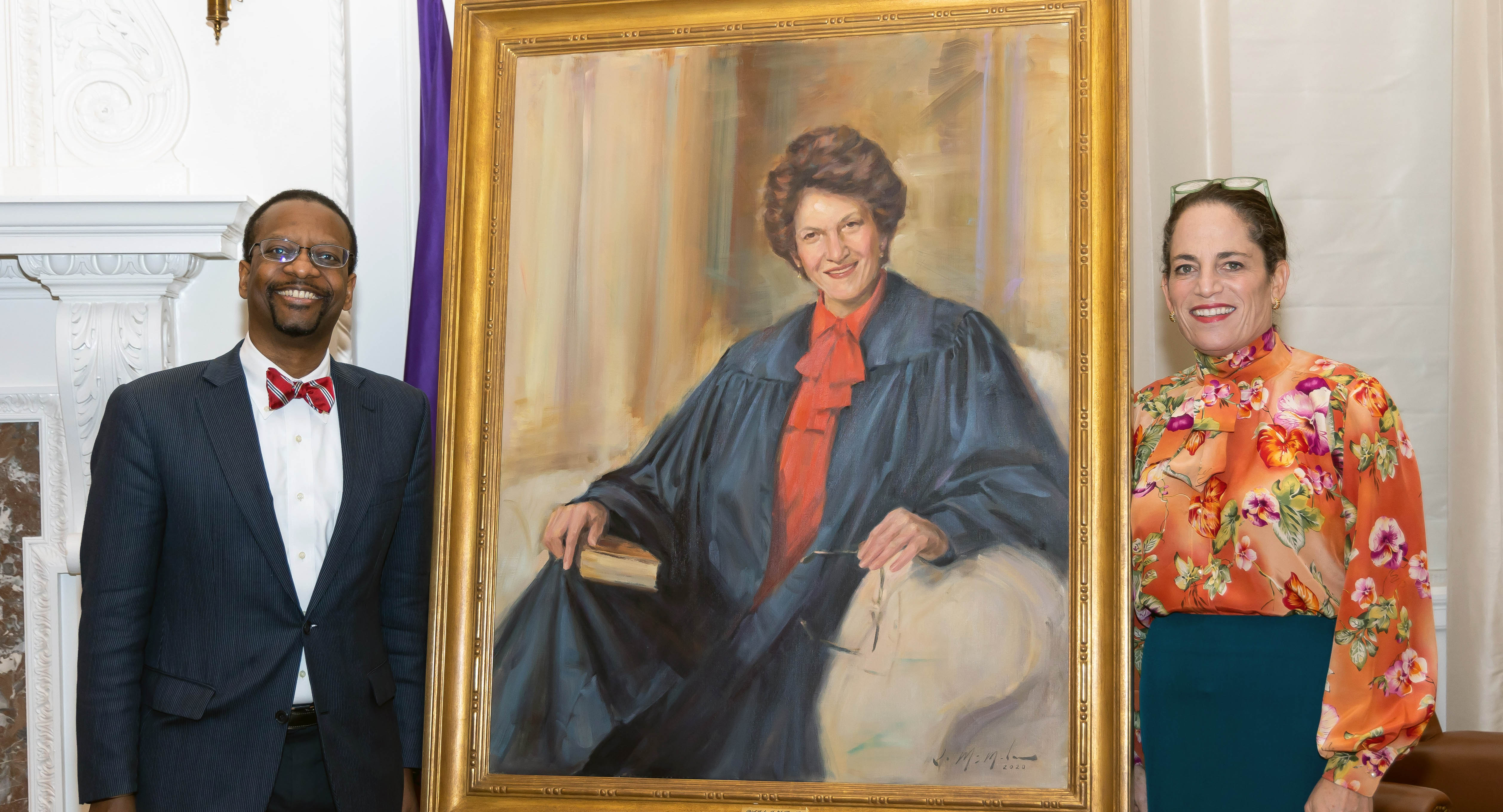 Troy McKenzie '00 and Luisa Hagemeier ’91 with the portrait of Judith Kaye '62