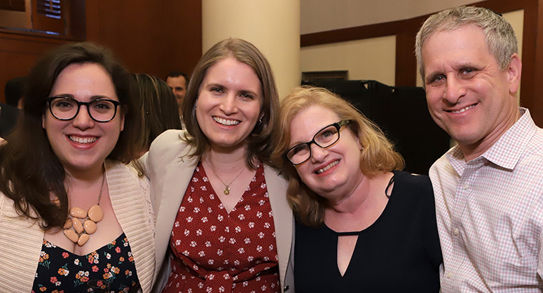 Graduating members of the first Masters in Cybersecurity Risk and Strategy class celebrating