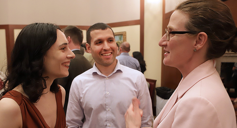 Graduating members of the first Masters in Cybersecurity Risk and Strategy class celebrating