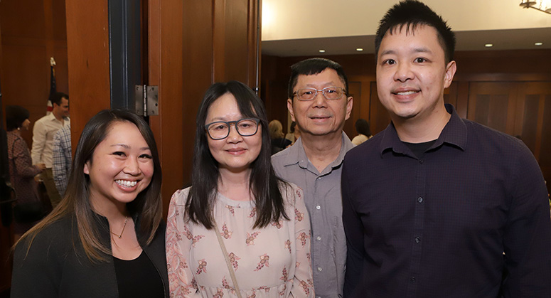 Graduating members of the first Masters in Cybersecurity Risk and Strategy class celebrating