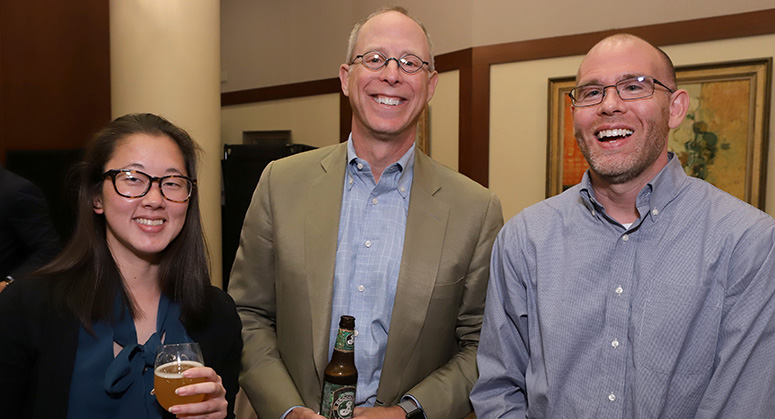 Graduating members of the first Masters in Cybersecurity Risk and Strategy class celebrating