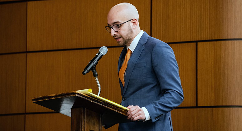 Jake Gold at lectern