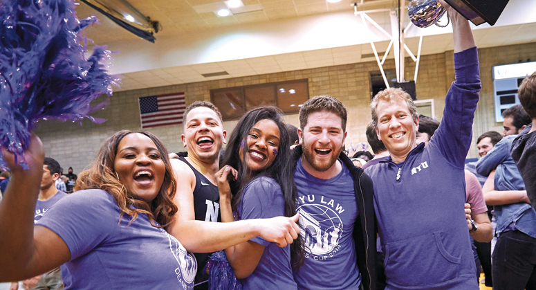 Trevor Morrison with students at the Deans' Cup basketball game