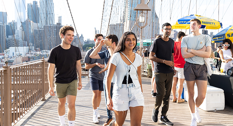 Group of students on Brooklyn Bridge pedestrian walkway