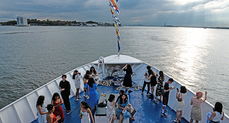 NYU Law students on boat deck during cruise of New York Harbor