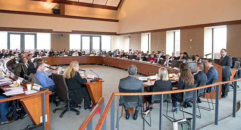 A side view of the entire room of panelists