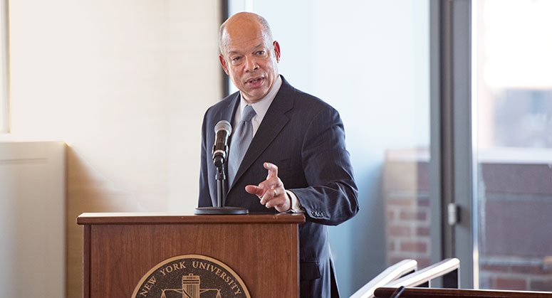 Jeh Johnson at a podium giving a keynote speech