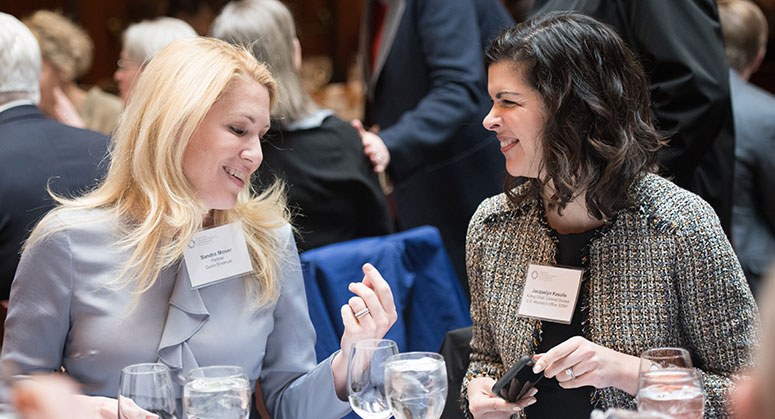 Sandra Moser and Jacquelyn Kasulis speaking at lunch