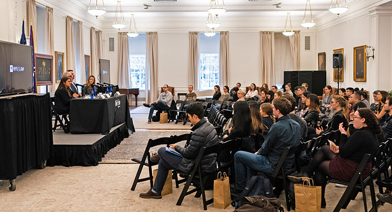 wide shot of Latham and Watkins forum audience and panel on February 26, 2020