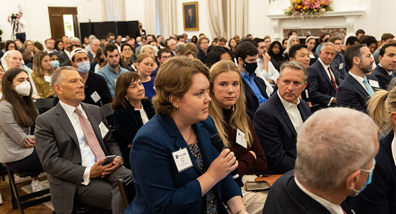 NYU Law student Emma Grover '23 asking a question from the audience.