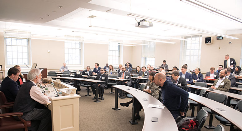 A view of the panelists in front of the room