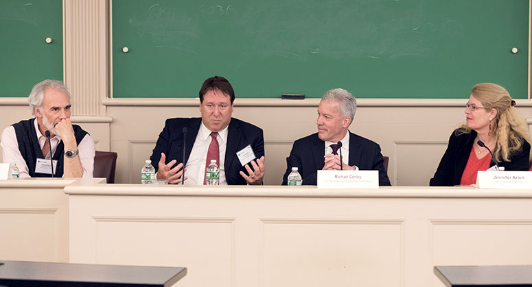 Ed Rock, Robert Stebbins, Michael Conley and Jennifer Arlen sitting at the panel