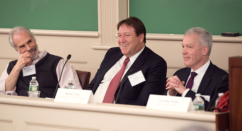 Ed Rock, Robert Stebbins and Michael Conley sitting on the panel smiling