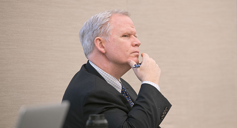 An audience member listening in on the panel