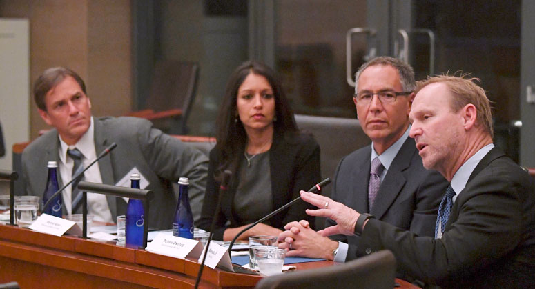 Walt Pavlo Jr. addressing the panel