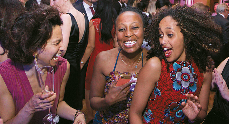 NYU Law alumni dancing together at the 2018 NYU Law Reunion