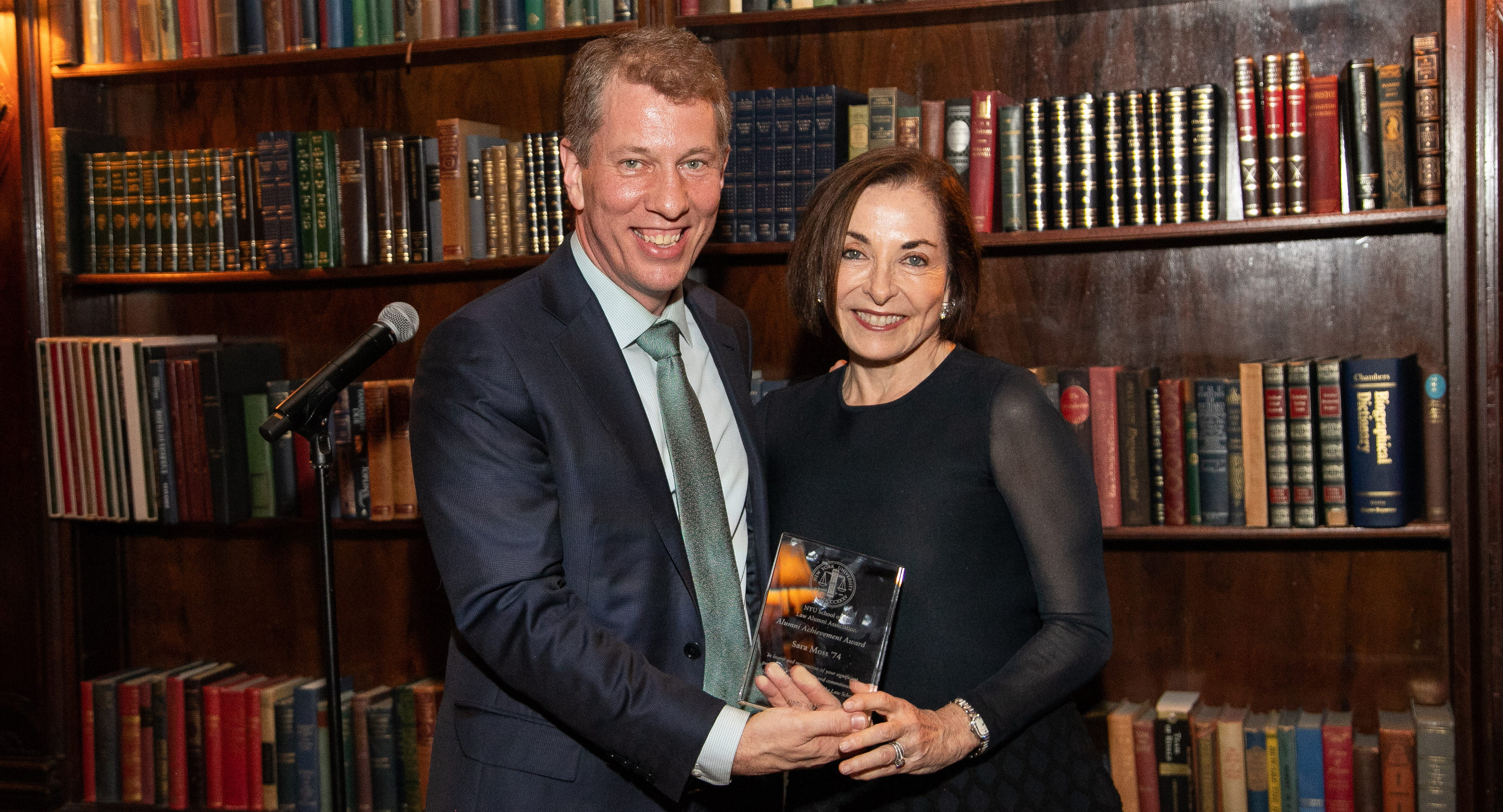 Sara Moss receiving an award from Dean Trevor Morrison at the 2019 Reunion