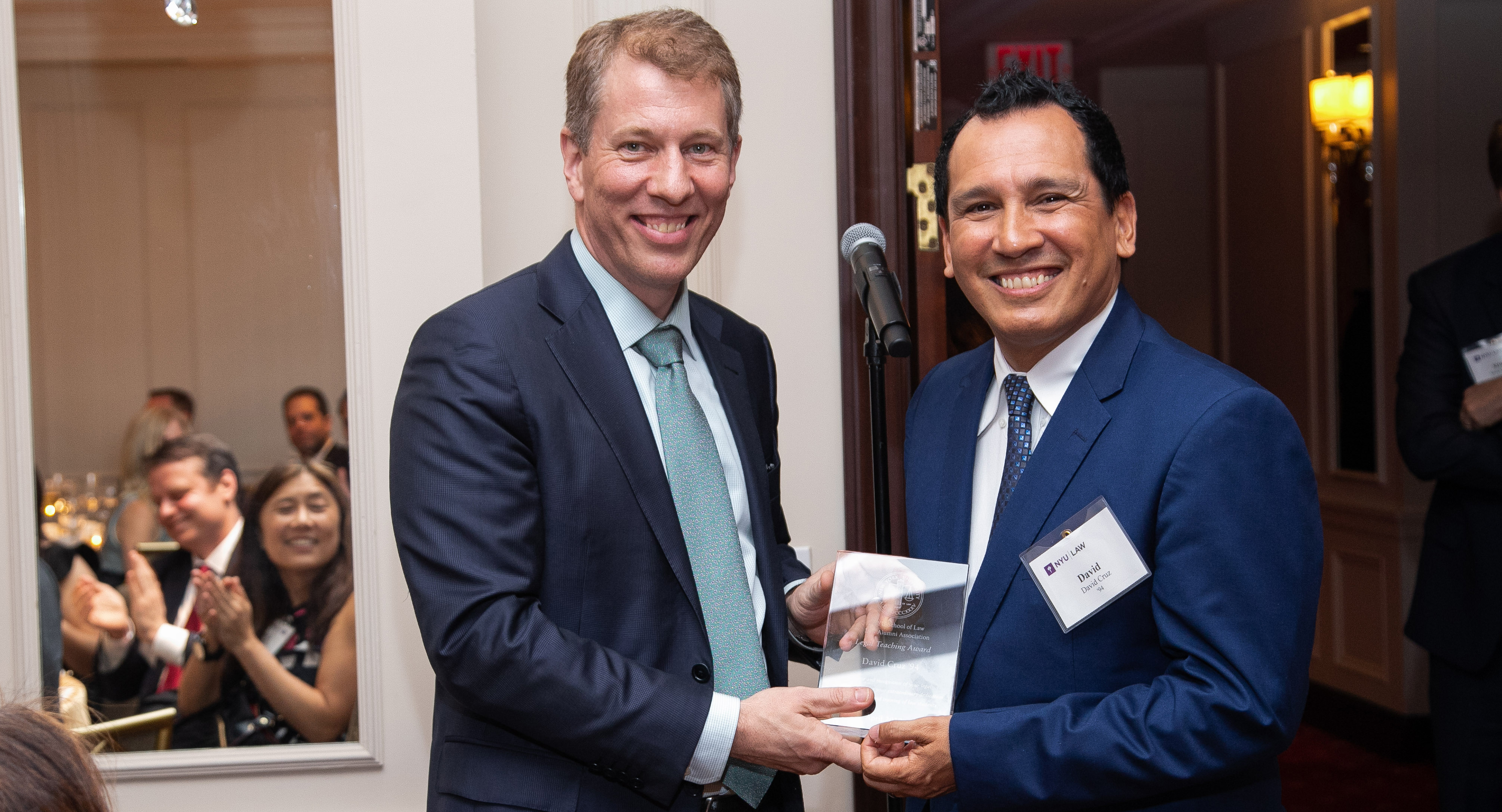 David Cruz receiving an award from Dean Trevor Morrison at Reunion 2019