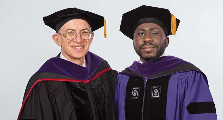 Erich Leyens Scholar Oluwasegun Motajo was hooded by Vice Dean Randy Hertz