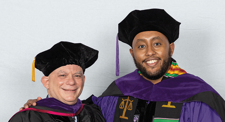Clifford Chance Scholar (AnBryce Program) Yonas Asfaw-Cooper was hooded by Evan Cohen