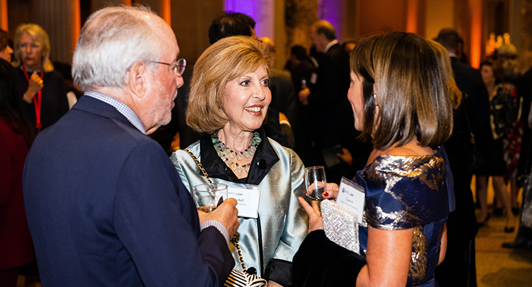 Alumni conversing at Weinfeld Gala