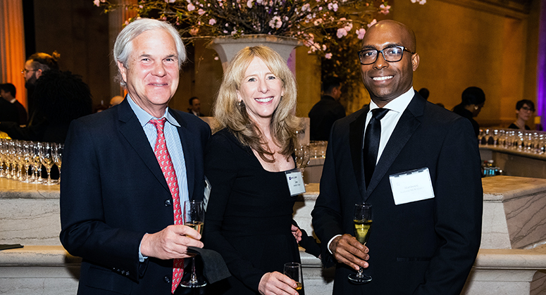 Two men and one woman at Weinfeld Gala