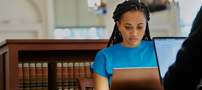 Student at laptop in library