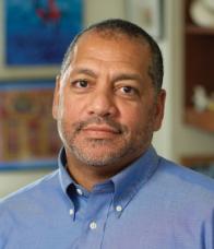 headshot of Tony Thompson wearing blue shirt