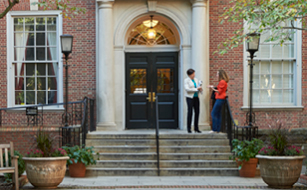 Helen Scott speaking with student in front of Vanderbilt Hall