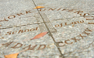 seal in Vanderbilt Hall Courtyard-- says "NYU School of Law"