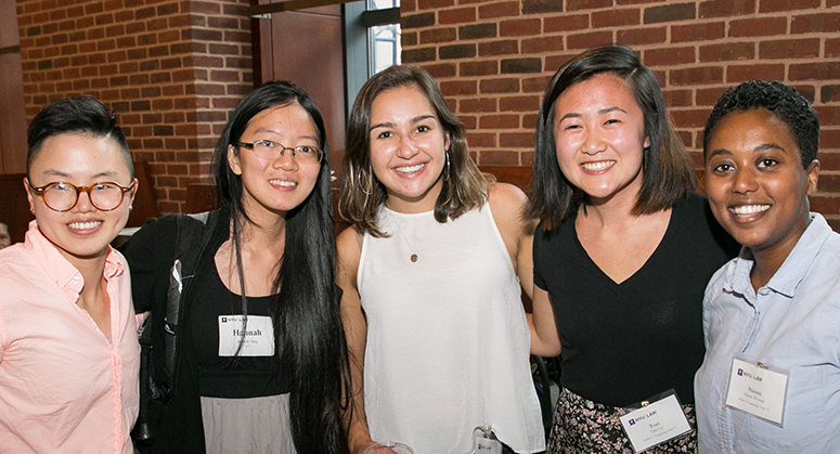 Students smiling at OutLaw/LACA reception